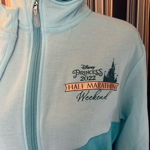 Like new, never worn 2022 Run Disney Princess Marathon blue full zip jacket.